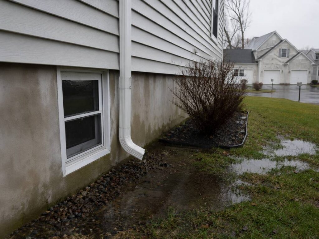 Storm damage and water intrusion around a New Jersey home's foundation